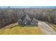 Two-story house with stone exterior and large driveway at 7519 Waterview Cv, Douglasville, GA 30135