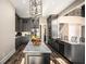 Modern kitchen with gray cabinetry, large island, and stainless steel appliances at 7519 Waterview Cv, Douglasville, GA 30135