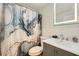 Updated bathroom with gray vanity and marble tile at 300 W Peachtree St # 12A, Atlanta, GA 30308