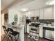 Modern kitchen with stainless steel appliances and granite countertops at 300 W Peachtree St # 12A, Atlanta, GA 30308