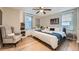 King-size bed, hardwood floors, and built-in shelving in main bedroom at 300 W Peachtree St # 12A, Atlanta, GA 30308