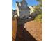 Backyard with hot tub, wooden fence, and sloped grass at 3109 Baylor Cir, Mcdonough, GA 30253