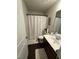Clean bathroom with white vanity, shower, and dark wood floor at 3109 Baylor Cir, Mcdonough, GA 30253