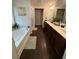 Large bathroom with double vanity, soaking tub, separate shower at 3109 Baylor Cir, Mcdonough, GA 30253