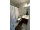 Clean bathroom, shower/tub combo, vanity with dark wood cabinets at 3109 Baylor Cir, Mcdonough, GA 30253