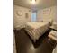 Spacious bedroom with leopard print bedding and dark wood floors at 3109 Baylor Cir, Mcdonough, GA 30253