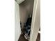Storage closet with shelving and hanging space for coats and luggage at 3109 Baylor Cir, Mcdonough, GA 30253