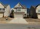 Two-story house on a tree-lined street with a gray exterior and attached garage at 3109 Baylor Cir, Mcdonough, GA 30253