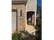 Brick front entrance with a dark gray door and landscaping at 3109 Baylor Cir, Mcdonough, GA 30253