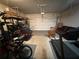 Finished garage, currently used as a gym with exercise equipment at 3109 Baylor Cir, Mcdonough, GA 30253