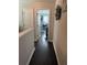 Hallway with view into home office and dark hardwood floors at 3109 Baylor Cir, Mcdonough, GA 30253