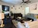 Spacious living room with comfy seating, a fireplace, and large windows at 3109 Baylor Cir, Mcdonough, GA 30253