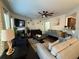 Bright living room with a fireplace, comfortable seating, and a large TV at 3109 Baylor Cir, Mcdonough, GA 30253