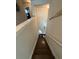 Modern staircase with dark wood treads and neutral wall colors at 3109 Baylor Cir, Mcdonough, GA 30253