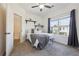 Bright bedroom with a queen bed, window, and ceiling fan at 4204 Mastic Pointe # 24, Acworth, GA 30101