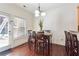 Dining area with hardwood floors and a charming light fixture at 4204 Mastic Pointe # 24, Acworth, GA 30101
