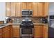Kitchen features stainless steel appliances and granite countertops at 4204 Mastic Pointe # 24, Acworth, GA 30101