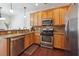 Well-equipped kitchen with stainless steel appliances and light wood cabinets at 4204 Mastic Pointe # 24, Acworth, GA 30101