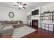 Spacious living room features a fireplace, hardwood floors, and built-in shelving at 4204 Mastic Pointe # 24, Acworth, GA 30101