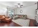Spacious living room featuring a sectional sofa and hardwood floors at 4204 Mastic Pointe # 24, Acworth, GA 30101