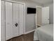 Bedroom with double doors and a view of another room at 1920 Hampton Walk Ct, Hoschton, GA 30548