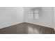 Light-filled bedroom featuring wood-look floors at 4770 Marco Ln, Cumming, GA 30028