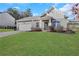 Attractive single-story home featuring a manicured lawn, and a two car garage at 4770 Marco Ln, Cumming, GA 30028