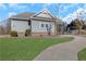 The exterior shows a path leading to a community pool and the side of the house at 4770 Marco Ln, Cumming, GA 30028