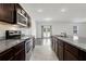 Galley kitchen with stainless steel appliances and granite countertops at 4770 Marco Ln, Cumming, GA 30028