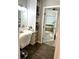 Vanity area with built in shelving and a large mirror reflecting the bathroom at 2051 Irwin Bridge Nw Rd, Conyers, GA 30012