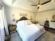 Main bedroom with a king-size bed, wood floors, and an accent wall at 2051 Irwin Bridge Nw Rd, Conyers, GA 30012