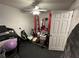 Bright home gym with a treadmill, weights, and mirror at 2051 Irwin Bridge Nw Rd, Conyers, GA 30012