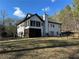 Charming two-story home with a screened porch and fenced backyard at 2051 Irwin Bridge Nw Rd, Conyers, GA 30012