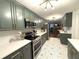 Modern kitchen with dark cabinets and geometric tile floors at 2051 Irwin Bridge Nw Rd, Conyers, GA 30012