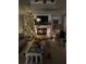 Cozy living room with a lit fireplace and Christmas tree at 2051 Irwin Bridge Nw Rd, Conyers, GA 30012