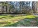 Large grassy backyard with mature trees and privacy at 52 Jennifer Ln, Carrollton, GA 30116