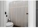 Simple bathroom with toilet and shower at 52 Jennifer Ln, Carrollton, GA 30116