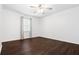 Well-lit bedroom with hardwood floors and window treatments at 52 Jennifer Ln, Carrollton, GA 30116