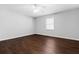 Bedroom with hardwood floors, ceiling fan, and window at 52 Jennifer Ln, Carrollton, GA 30116