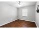 Bright bedroom with hardwood floors and a ceiling fan at 52 Jennifer Ln, Carrollton, GA 30116