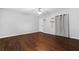 Bedroom featuring hardwood floors, a ceiling fan and window coverings at 52 Jennifer Ln, Carrollton, GA 30116