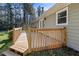 Wooden deck with railing, offering backyard access at 52 Jennifer Ln, Carrollton, GA 30116