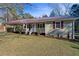 Ranch style home with a covered porch and landscaped yard at 52 Jennifer Ln, Carrollton, GA 30116