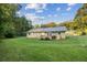 Back exterior of house showing deck and yard at 52 Jennifer Ln, Carrollton, GA 30116