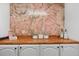 Laundry room with a custom floral wall and butcher block countertop at 52 Jennifer Ln, Carrollton, GA 30116