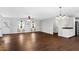 Living room with hardwood floors and an archway to the kitchen at 52 Jennifer Ln, Carrollton, GA 30116