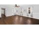 Bright living room featuring hardwood floors and ceiling fan at 52 Jennifer Ln, Carrollton, GA 30116