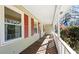 Front porch with wooden floor, white railings, and red shutters at 52 Jennifer Ln, Carrollton, GA 30116