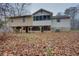 Another view of the back of the house, highlighting its screened-in porch at 5520 Hearn Rd, Ellenwood, GA 30294