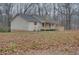 House exterior showcasing a ranch style home with a porch and surrounding yard at 5520 Hearn Rd, Ellenwood, GA 30294